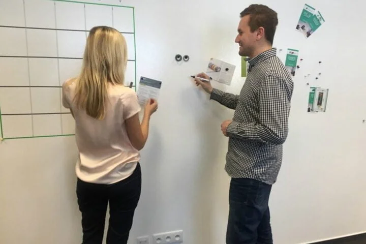 Man writing on a Smart Whiteboard Paint White surface